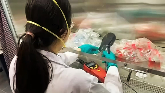 Technician preparing samples for analysis